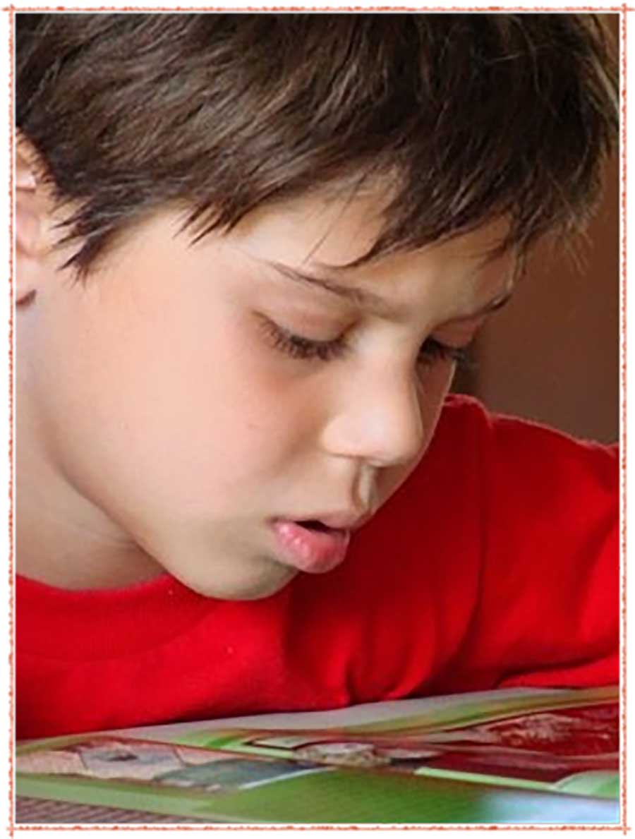 Child reading at The Workshop Reading Centre