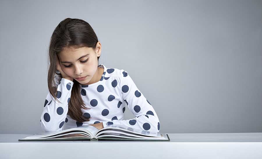 Child focused on reading